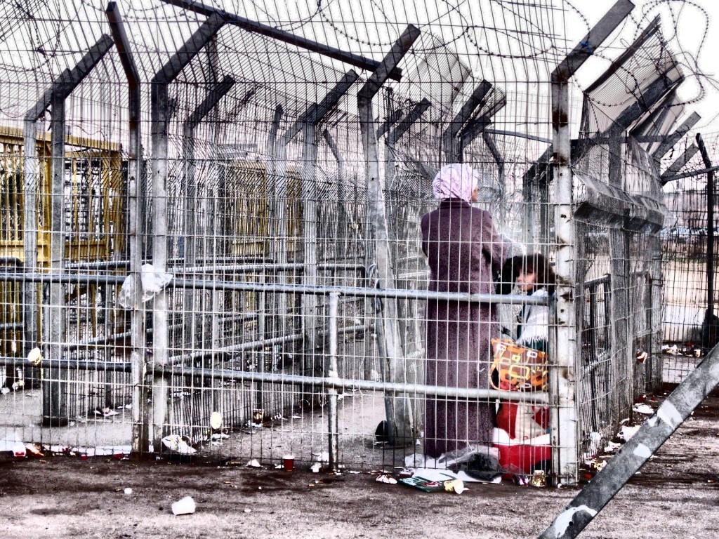 Palestinian woman and children at Taybe checkpoint